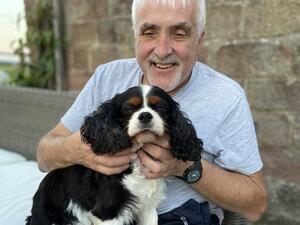 Grace having a cuddle with Dad