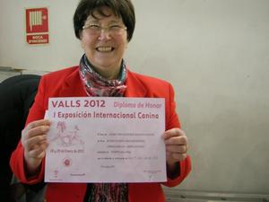 Sally Murphy Proudly holding Giovanni's Diploma of